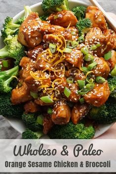 a bowl filled with orange sesame chicken and broccoli on top of a table