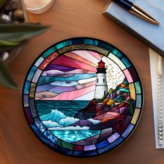 a stained glass plate sitting on top of a wooden table