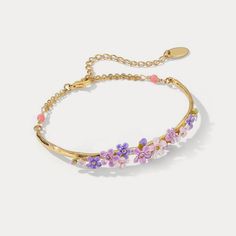 The aura of romance that surrounds forget-me-not flowers makes these bracelets special gifts for women at any occasion. Taking on timeless design, these flower bracelets go with any outfits. Dipped in 18K gold and sophisticatedly enamelled, these bracelets look elegant and luxurious around your wrist. DETAILS Plating: 18K Gold Materials: 18K Gold on Brass, Enamel Measurements: Length: 8.67" (22cm) + Extender: 1.97" (5.0cm) Weight: 7.3 g Hypoallergenic design Anniversary Bracelets With Flower Charm, Spring Flower Charm Bracelet Gift, Spring Gift Bangle, Spring Wedding Bangle Bracelets, Flower Charm Bracelet For Anniversary, Delicate Flower Charm Bracelet For Spring, Flower Shaped Bracelet With Flower Charm For Anniversary, Spring Bangle Jewelry Gift, Flower Decoration Bracelets As Gift