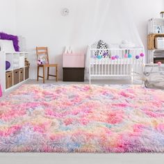 a child's room with white walls and colorful rugs