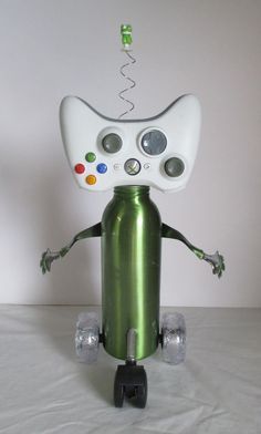 a green and white robot is standing on wheels with its head turned to the side