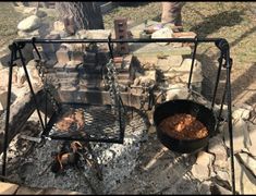 an outdoor grill with food cooking on it