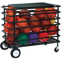 a cart filled with basketballs and balls on top of each other in different colors