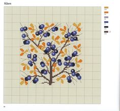 a cross stitch tree with blue and orange leaves on it's branches is shown