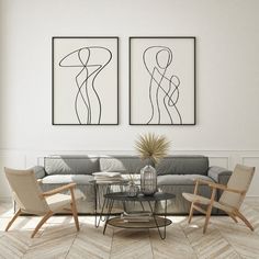 two paintings hang on the wall above a gray couch and chairs in a living room