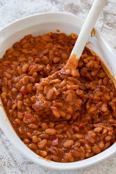 baked beans in a white bowl with text overlay