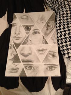 a black and white photo of many different people's faces on a sheet of paper