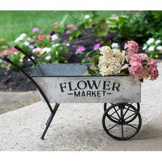 a flower market wagon with flowers in it