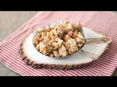 a bowl filled with cereal and nuts on top of a table