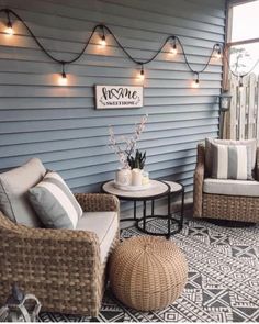 two wicker chairs sitting on top of a patio