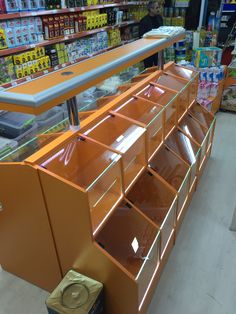 an orange display case in a store filled with items