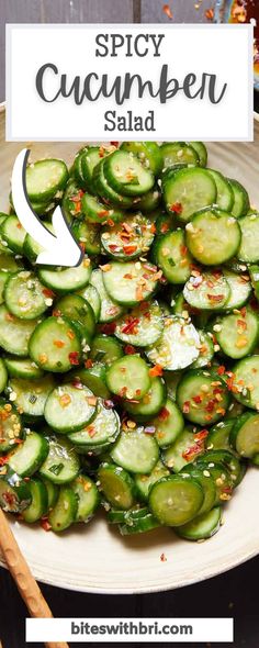 a white plate topped with sliced cucumbers next to chopsticks and seasoning