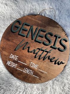 a wooden sign that says, genest's mathew date time weight length