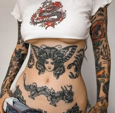 a woman with tattoos on her stomach