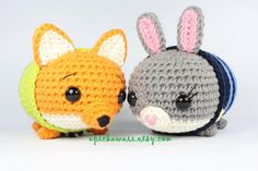 two small crocheted animals sitting next to each other