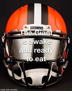 an orange and white football helmet with the words browns on it's front side