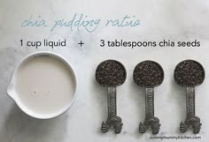 three spoons with oreo cookies on them next to a cup of milk