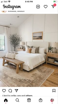 a bed room with a neatly made bed next to a window and a rug on the floor