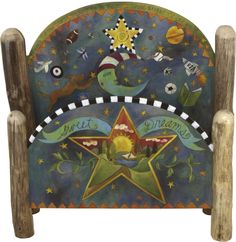 a wooden chair with an artistic design on the front and back sides, decorated with stars