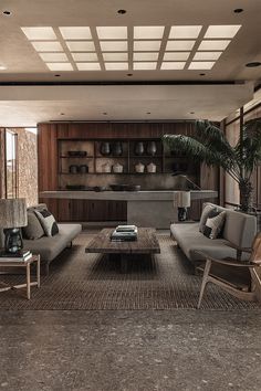 a living room filled with lots of furniture and decor on top of carpeted flooring