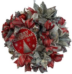 a christmas wreath with silver and red decorations