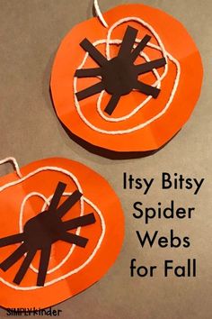 two orange and black paper pumpkins with the words it'sy bitsy spider webs for fall