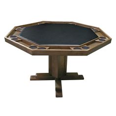 a wooden table with a black top and four holes in the center on one leg