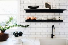 the kitchen counter is clean and ready to be used as a shelf above the sink