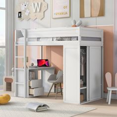 a white loft bed with desk underneath it in a child's bedroom or playroom