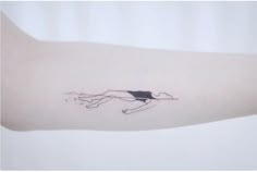 a woman's arm with a black and white drawing of a person on it