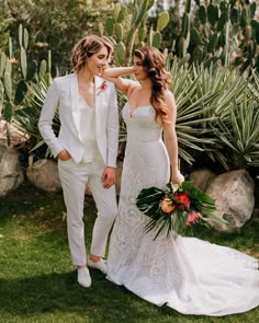 a bride and groom standing in front of cacti at their wedding day,