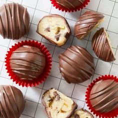 several chocolate covered desserts sitting on top of a counter