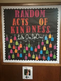 a bulletin board with the words random acts of kindness written on it in front of a classroom door