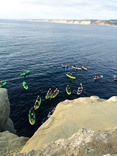 many people are kayaking in the ocean