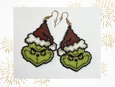 These stunning handmade beaded Grinch earrings are the perfect way to get into the holiday spirit. The earrings are not only a stylish accessory but also a conversation starter and being handmade ensures that each pair is unique, making them a special gift idea for Grinch lovers and jewellery enthusiasts alike.  Japanese Miyuki Delica glass seed beads size 11 were used in making these fabulous earrings, in the colours red, white, linen, yellow, black, light and dark green, gold or silver, using Colorful Beads Christmas Earrings Gift, Christmas Dangle Beaded Earrings With Colorful Beads, Christmas Colorful Beaded Dangle Earrings, Colorful Beads Earrings For Christmas Gift, Christmas Gift Earrings With Colorful Beads, Handmade Jewelry For Christmas Crafting, Christmas Beaded Dangle Earrings With Ear Wire, Christmas Dangle Beaded Earrings With Ear Wire, Christmas Beaded Earrings As Gift