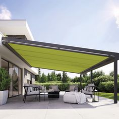 a patio covered in furniture and shade