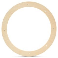 an unfinished wooden circle with holes in the center on a white background stock photo - 1389782