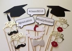 graduation cupcake toppers with mustaches, hats and glasses are on a table