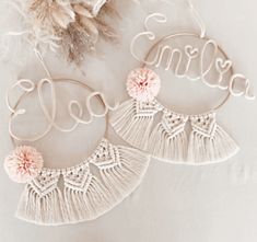 two personalized hoop earrings with tassels and flowers