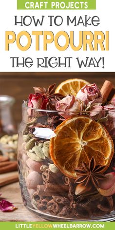 a glass jar filled with orange slices and spices