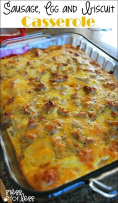 sausage, egg and biscuit casserole in a glass baking dish with text overlay