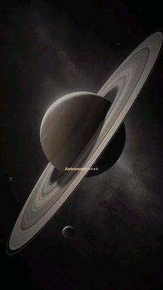 an artist's rendering of saturn with its rings in the dark sky, and two planets