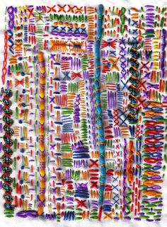 an art work made with colored threads and crochet stitchs on white paper