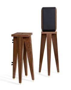 two wooden stools sitting next to each other