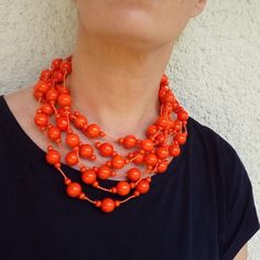 Orange  Necklace Orange color is very popular this year also the shape of the necklace is very attractive, elegant and modern. You can wear a necklace in many different dress styles. The necklace is made of wooden beads because is the necklace very light and comfortable. You can wear a necklace for many years, but be careful and please not to go into the water with it. ---------------------------- If you wish you have a set, you can also have a bracelet and a ring: Bracelets: https://www.etsy.co Handmade Orange Beaded Necklaces, Handmade Gifts For Girlfriend, Orange Statement Necklace, Wool Necklace, Different Dress Styles, Funky Necklace, Orange Jewelry, Necklace Orange, Orange Necklace