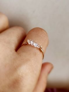 Petite and dainty raw crystal ring with Herkimer diamond ✨ Handmade in 14K Gold Filled, Rose Gold Filled, Sterling Silver, April birthstone gift 🖤 Simple design stacking ring with genuine Herkimer diamond. Very dainty and cute ring for everyday wear. *Gemstone Size: 2-3 mm *Ring Band:  0.8 mm  * Handmade in your ring size natural gemstones and 14K gold-filled, rose gold filled or sterling silver. * Gold-filled and sterling silver are known for their lasting quality. This ring won't tarnish and Dainty Adjustable Crystal Promise Ring, Adjustable Dainty Crystal Promise Ring, 14k Gold Crystal Ring With Si Clarity For Anniversary, Rose Gold White Topaz Ring Jewelry, Rose Gold White Topaz Ring, Delicate Crystal Ring With Rose Cut Diamonds For Gift, Delicate Adjustable 14k Gold Crystal Ring, Dainty Diamond White Crystal Ring For Gift, Dainty Diamond White Crystal Ring As Gift