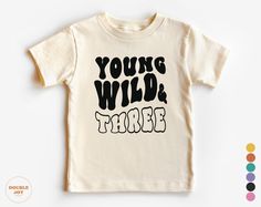 a white shirt with the words young wild tribe printed on it