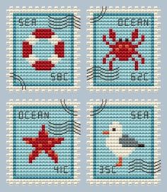 four cross stitch stamps with sea animals on them