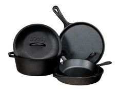 three black pots and pans sitting next to each other on a white background with the lid open