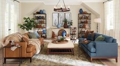 a living room filled with furniture and a fire place